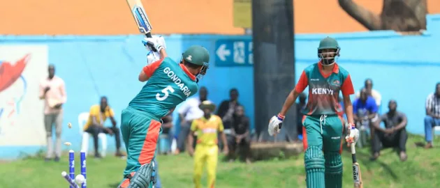 Kenya's Dhiren Gondaria is cleaned bowled by Uganda's Charles Waiswa