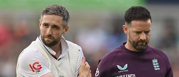 Chris Woakes walks off the field