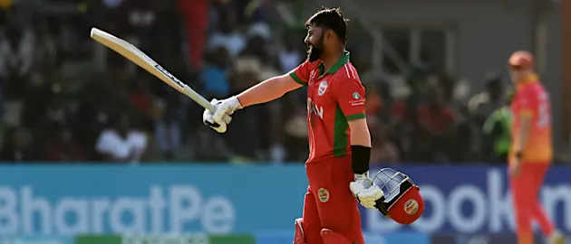 Kashyap Prajapati of Oman celebrates their century during the ICC Men's Cricket World Cup Qualifier Zimbabwe 2023 Super 6 match between Zimbabwe and Oman at Queen’s Sports Club on June 29, 2023 in Bulawayo, Zimbabwe.