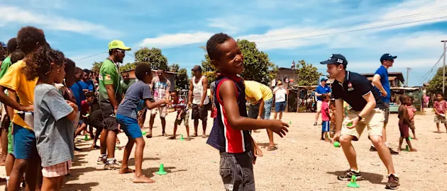 Cricket being played in Hanuabada village, PNG