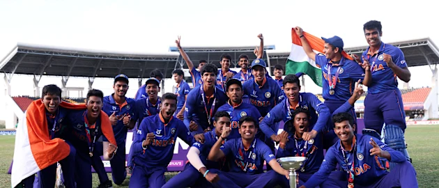 Players of India celebrate with the ICC U19 Men's World Cup Trophy following the ICC U19 Men's Cricket World Cup Final match between England and India at Sir Vivian Richards Stadium on February 05, 2022 in Antigua, Antigua and Barbuda.