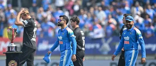 India's Virat Kohli (L) and Rohit Sharma (R) arrive for the national anthem before the start of the first one-day international