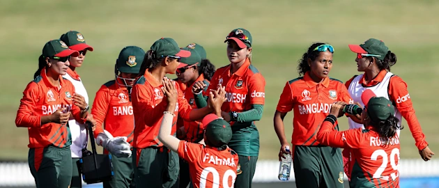Bangladesh celebrate the wicket of Nida Dar of Pakistan during the 2022 ICC Women's Cricket World Cup match between Pakistan and Bangladesh at Seddon Park on March 14, 2022 in Hamilton, New Zealand.