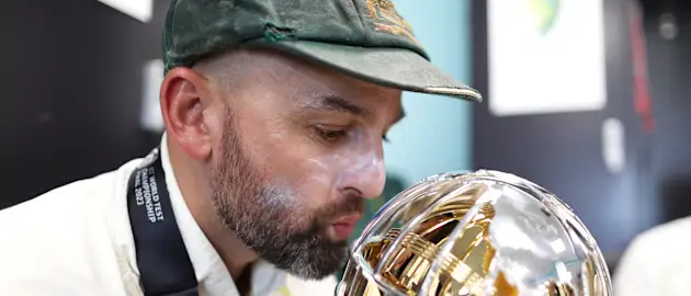 Nathan Lyon of Australia poses for a photo with the ICC World Test Championship Mace in the changing room on day five of the ICC World Test Championship Final between Australia and India