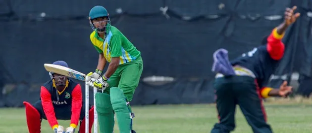 Vincent Ateak from Ghana bowling to Harsheed Chohan of Tanzania