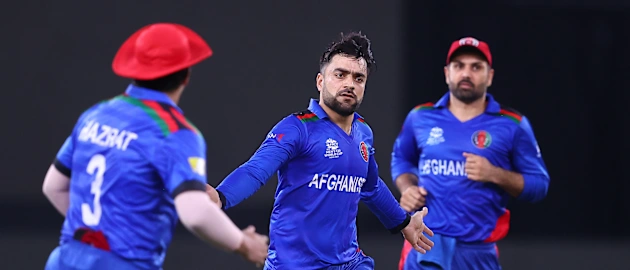 Rashid Khan of Afghanistan celebrates the wicket of Babar Azam of Pakistan during the ICC Men's T20 World Cup match between Pakistan and Afghanistan 1920x1080