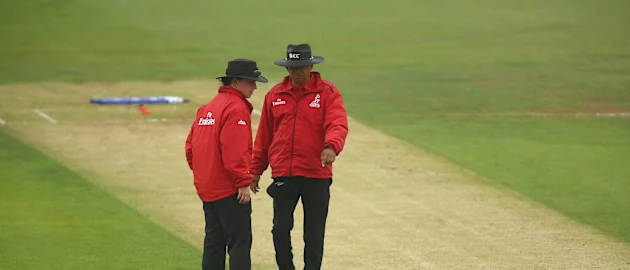 Umpires Shaun George and Claire Polosak