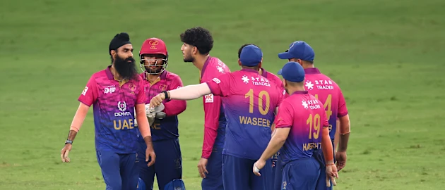 Simranjeet Singh of UAE celebrates with team mates 