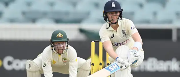 Heather Knight of England bats watched by Alyssa Healy of Australia during day two of the Women's Test match in the Ashes series between Australia and England at Manuka Oval