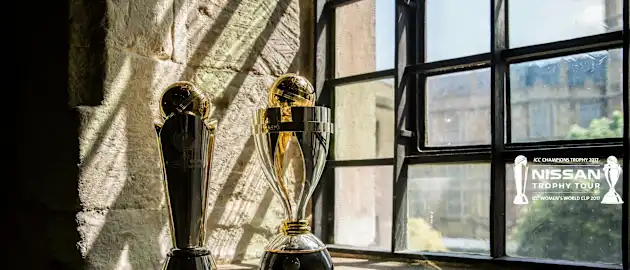 The ICC Champions Trophy and ICC Women's World Cup Trophy on display at the Nissan Trophy Tour in London
