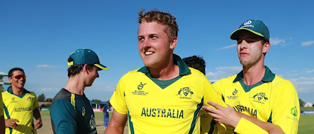 Connor Sully of Australia is mobbed by his team, after hitting the winning runs during the ICC U19 Cricket World Cup Group B match between Australia and England at De Beers Diamond Oval on January 23, 2020 in Kimberley, South Africa.