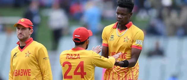 Sikandar Raza and Blessing Muzarabani of Zimbabwe celebrate a wicket