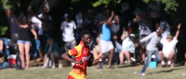 Blessing Muzarabani of Zimbabwe celebrates taking the last wicket of Brad Wheal (unseen) of Scotland during the ICC Cricket World Cup Qualifier between Zimbabwe and Scotland at QSC on March 12, 2018 in Bulawayo, Zimbabwe (©ICC).