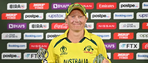 Alyssa Healy of Australia poses with the Player of the Match and Tournament award after the 2022 ICC Women's Cricket World Cup Final match between Australia and England at Hagley Oval on April 03, 2022 in Christchurch, New Zealand.