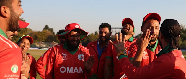 Players of Oman celebrate following the ICC Men's Cricket WorldCup Qualifier Zimbabwe 2023 match between Oman and United Arab Emirates at Bulawayo Athletic Club on June 21, 2023 in Bulawayo, Zimbabwe.