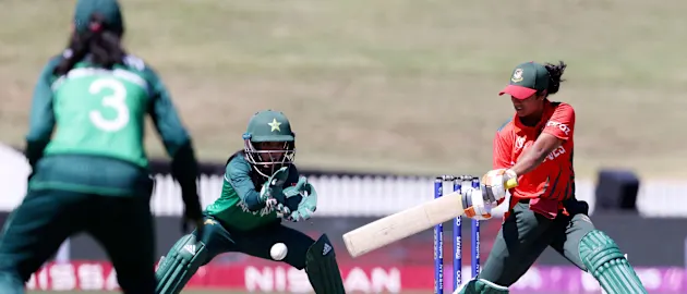 Bangladeshs Fargana Hoque Pinky plays a shot as Pakistan's Sidra Nawaz looks on
