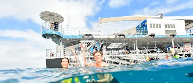 Adam Zampa & Erin Holland take the trophy for a swim on the reef