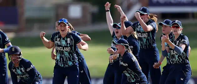 Players of England celebrate after Milly Illingworth of Australia is dismissed.