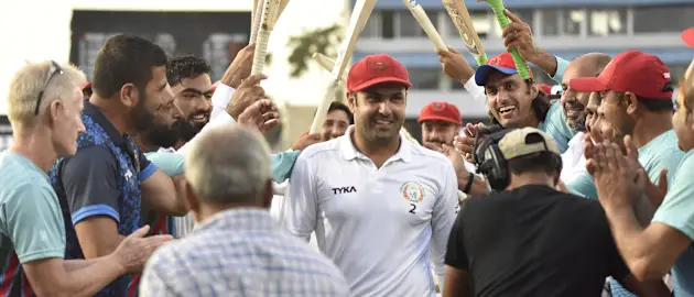 Nabi walks off to guard of honour