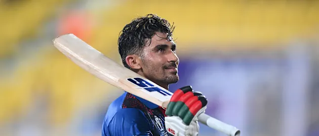 Rahmanullah Gurbaz of Afghanistan acknowledges the crowd during the ICC Men's Cricket World Cup India 2023 warm up match between Afghanistan and Sri Lanka at Barsapara Cricket Stadium on October 03, 2023 in Guwahati, India.