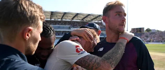 Stokes engulfed by emotional team-mates after his timeless epic