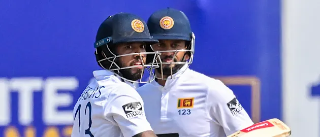 Sri Lanka's captain Dimuth Karunaratne (R) and Kusal Mendis run between the wickets during the first day of the first cricket Test match between Sri Lanka and Ireland 1920x1080