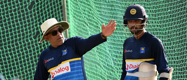 Sri Lanka coach Chandika Hathurusingha speaks with Dinesh Chandimal