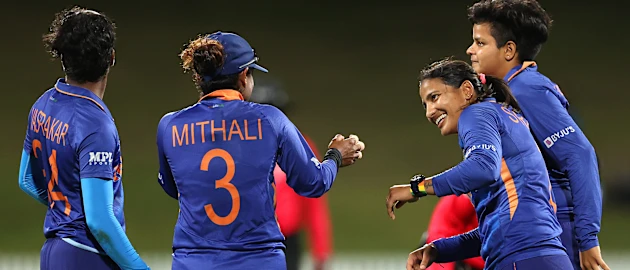 Sneh Rana of India celebrates with team mates after catching out Nahida Akter of Bangladesh during the 2022 ICC Women's Cricket World Cup match between India and Bangladesh at Seddon Park on March 22, 2022 in Hamilton, New Zealand.