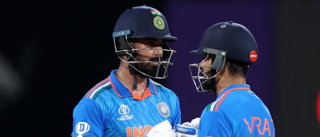 Virat Kohli (L) and KL Rahul of India interact during the ICC Men's Cricket World Cup India 2023 between India and Australia