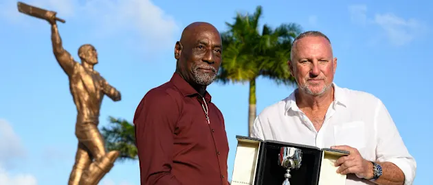 Sir Vivian Richards and Sir Ian Botham display the trophy