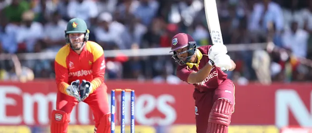 Brendan Taylor of Zimbabwe looks on as Shai Hope of The Windies scores runs during The Cricket World Cup Qualifier between The Windies and Zimbabwe at The Harare Sports Club on March 19, 2018 in Harare, Zimbabwe (©ICC).