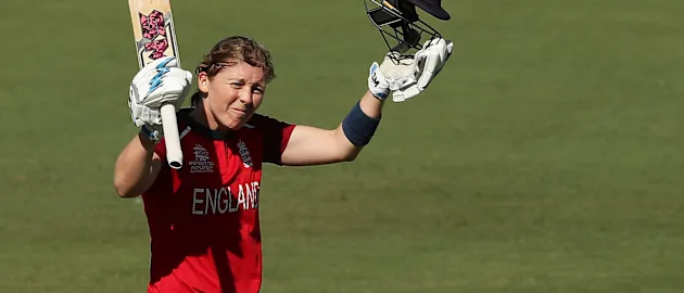 Heather Knight of England celebrates and acknowledges the crowd after scoring a century during the ICC Women's T20 Cricket World Cup match between England and Thailand at Manuka Oval on February 26, 2020 in Canberra, Australia.