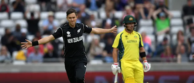 Trent Boult celebrates after dismissing David Warner