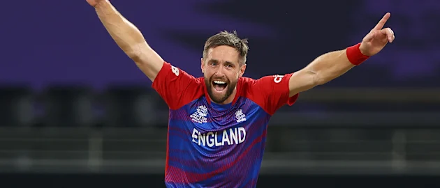 Chris Woakes of England celebrates the wicket of Glenn Maxwell of Australia during the ICC Men's T20 World Cup match between Australia and England at Dubai International Stadium on October 30, 2021 in Dubai, United Arab Emirates.