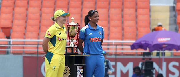 Alyssa Healy and Harmanpreet Kaur with the ODI series trophy