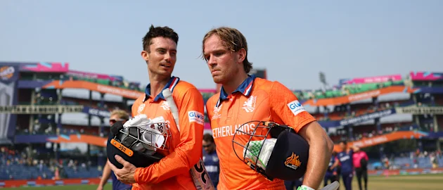 : Bas de Leede and Scott Edwards of Netherlands interact following the ICC Men's T20 World Cup India & Sri Lanka 2026 match between Netherlands and Namibia at Arun Jaitley Stadium