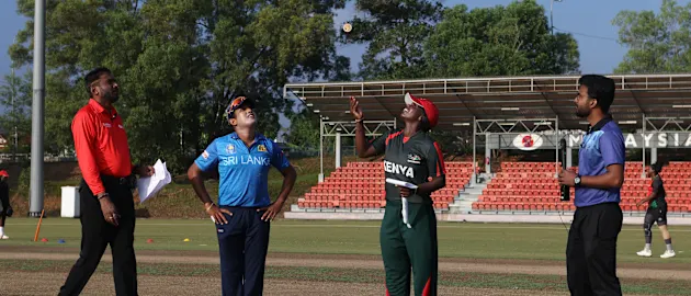 Margaret Banja Ngoche of Kenya flips the coin as Chamari Athpaththu looks on