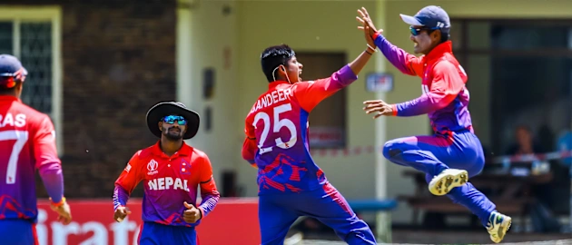 Nepal bowler Sandeep Lamichhane celebrates a wicket with team mates during a World Cup Qualifier play off cricket match between Nepal and Papua New Guinea at Old Hararians Sports Club March 15 2018 (©ICC).