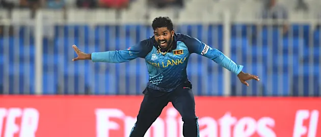 Wanindu Hasaranga of Sri Lanka celebrates the wicket of Jonny Bairstow of England during the ICC Men's T20 World Cup match between England and Sri Lanka at Sharjah Cricket Stadium on November 01, 2021 in Sharjah, United Arab Emirates.