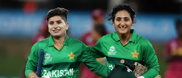 Nida Dar (L) and Bismah Maroof (R) of Pakistan celebrate victory after hitting the winning runs during the ICC Women's T20 Cricket World Cup match between the West Indies and Pakistan at Manuka Oval on February 26, 2020 in Canberra, Australia.