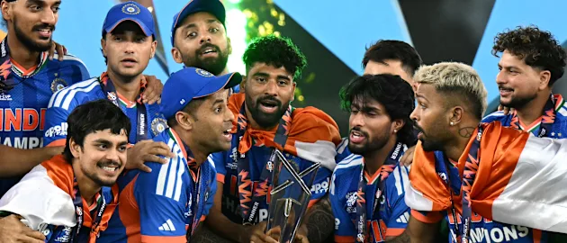 India's players celebrate with the trophy after winning the 2026 ICC Men's T20 Cricket World Cup final match against New Zealand
