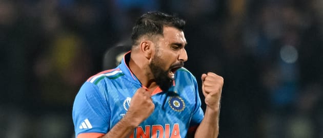 India's Mohammed Shami celebrates after taking the wicket of New Zealand's Matt Henry during the 2023 ICC Men's Cricket World Cup one-day international (ODI) match between India and New Zealand