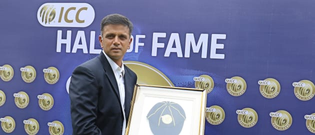 Rahul Dravid poses for the photographers with his ICC Cricket Hall of Fame cap