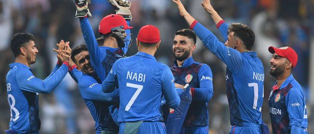 Rashid Khan of Afghanistan celebrates the wicket of Mitchell Starc of Australia during the ICC Men's Cricket World Cup India 2023 between Australia and Afghanistan