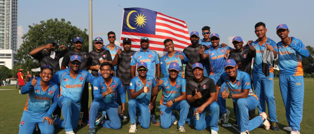 Malaysia team celebrates after winning their opening encounter against Uganda