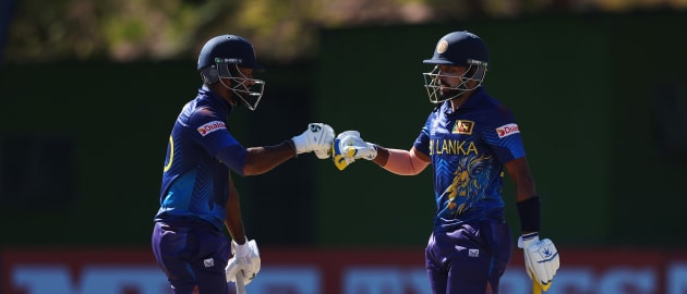 Dimuth Karunarathana and Sadeera Samarawickrama of Sri Lanka fist bump during the ICC Men's Cricket World Cup Qualifier Zimbabwe 2023 match between the Sri Lanka and Ireland