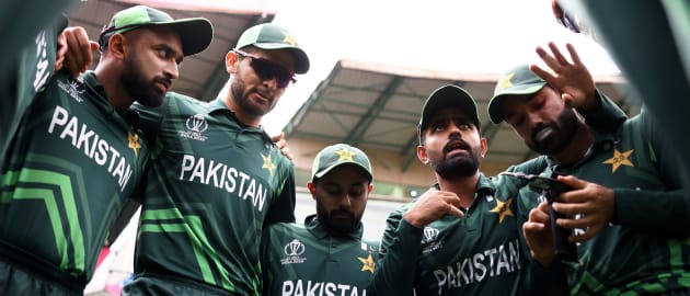 Babar Azam of Pakistan speaks to their side in the huddle ahead of the ICC Men's Cricket World Cup India 2023 between New Zealand and Pakistan