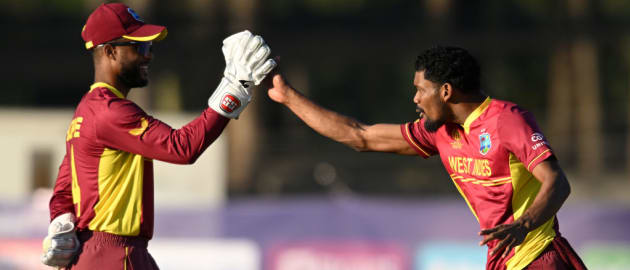 Keemo Paul of West Indies celebrates the wicket of Gulshan Jha of Nepal with team mate Shai Hope during the ICC Men's Cricket World Cup Qualifier Zimbabwe 2023 match between the West Indies and Nepal at Harare Sports Club on June 22, 2023.