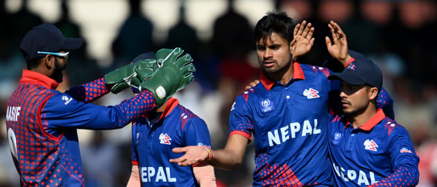 Dipendra Singh Airee of Nepal (L) and Sompal Kami of Nepal run between the wickets during the Asia Cup Group A match between India and Nepal