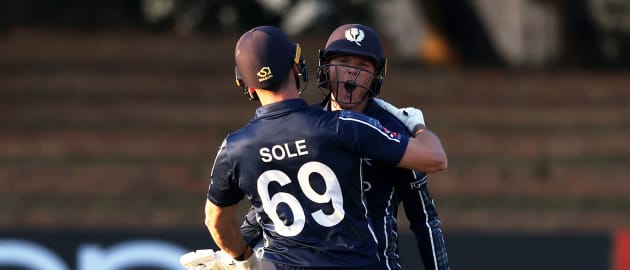 Chris Sole and Michael Leask of Scotland celebrate following the ICC Men's Cricket World Cup Qualifier Zimbabwe 2023 match between Ireland and Scotland